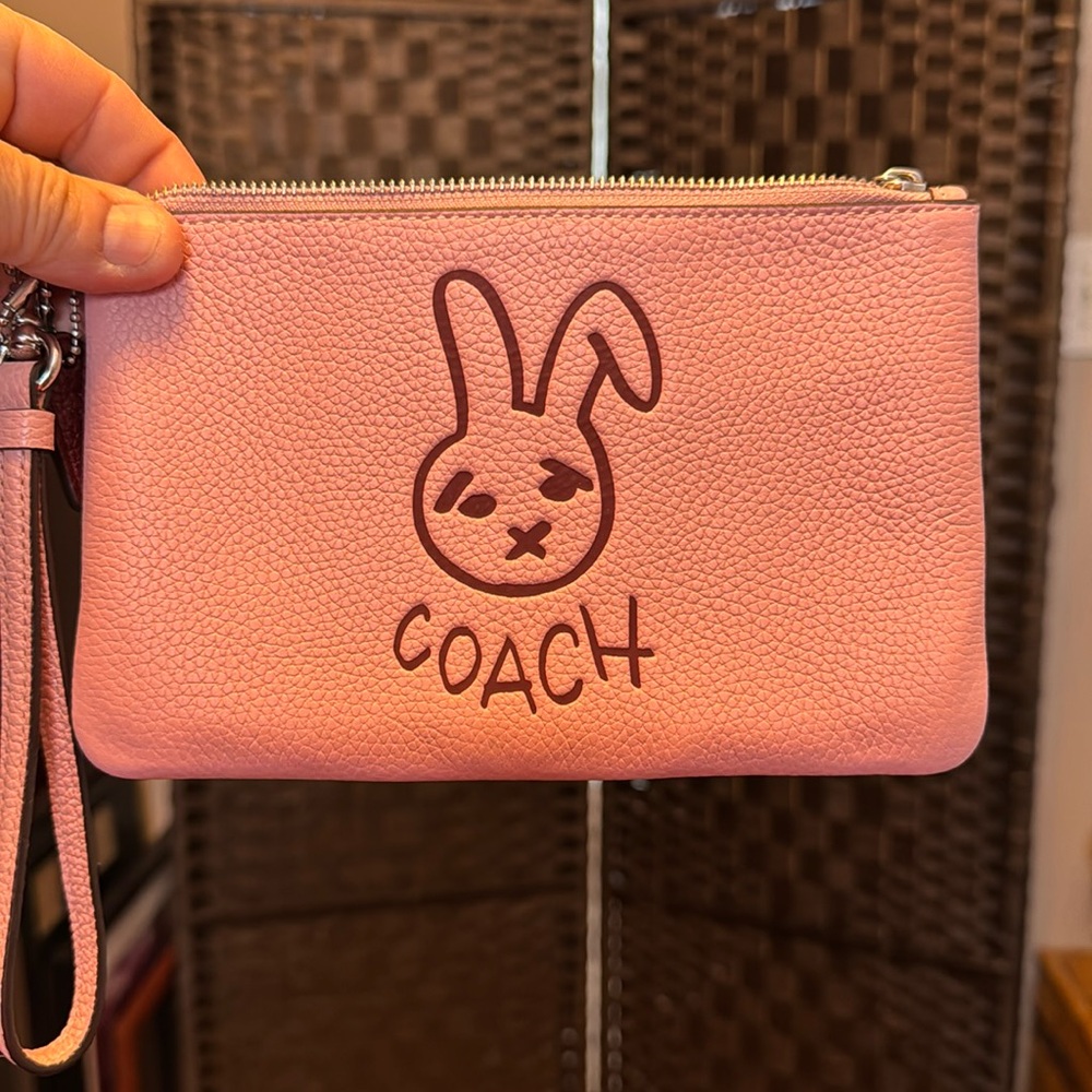 New without tags coach bunny wristlet pink and maroon.